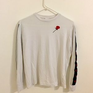 A white long sleeve t-shirt with roses